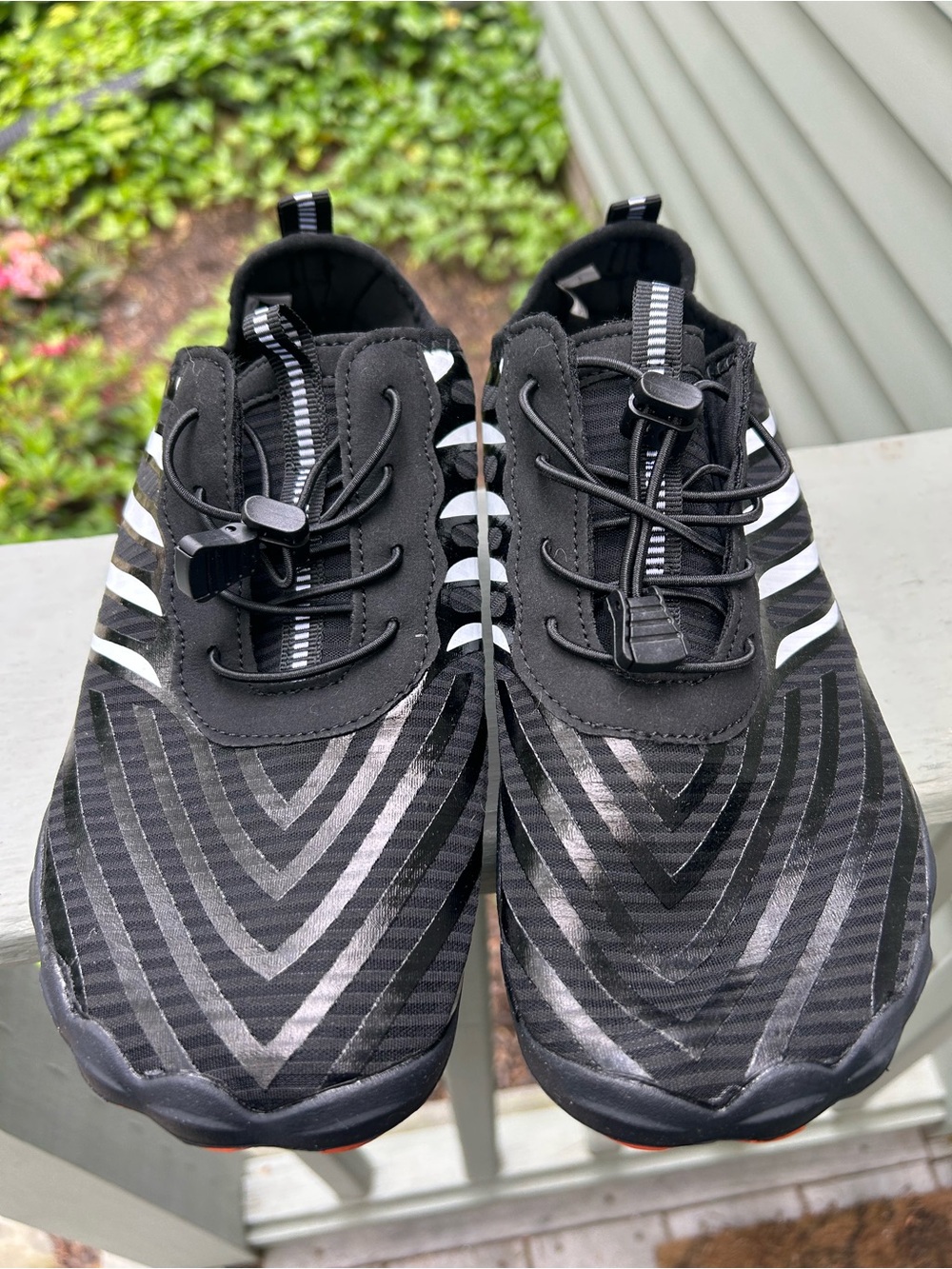 Women's Black Athletic Slip-On Trainers with Reflective Stripes